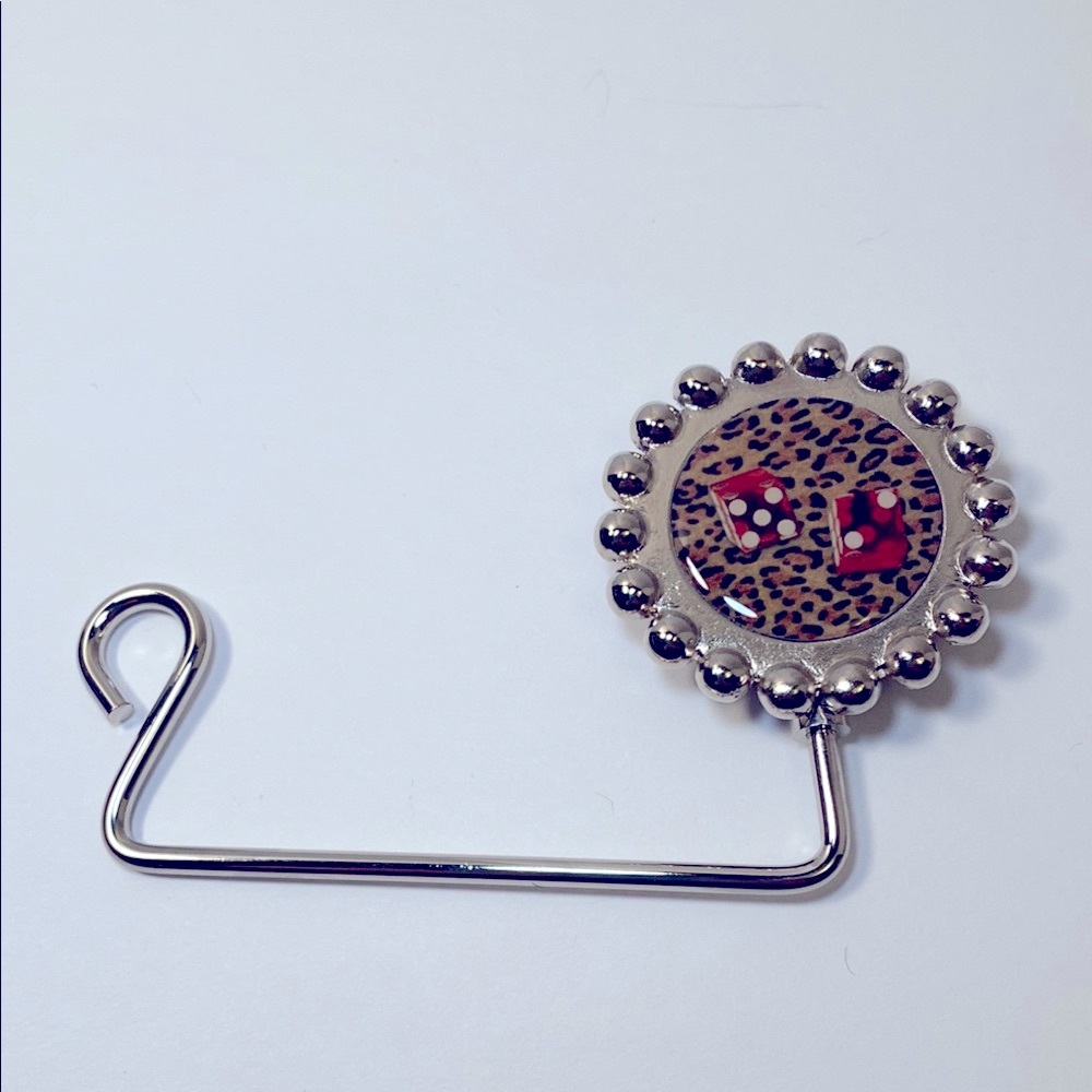 Retro purse hanger in silver with red dice on leopard print